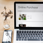 Blog image showing laptop screen written 'online purchase' illustrating E-Commerce Organic Traffic
